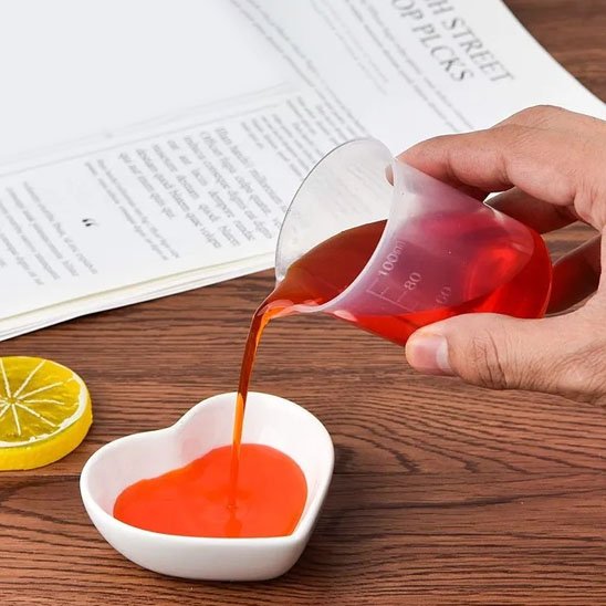 Transvasement gélée orange avec Verre doseur 